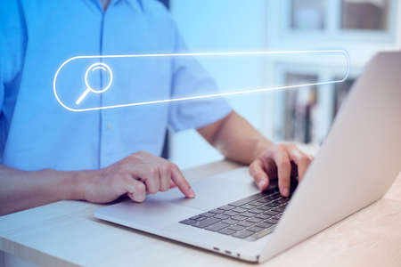 Search technology, search engine optimization,person using laptop to search information, using search bar function on your website. SEO.の写真素材