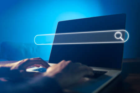 Search technology, search engine optimization,person using laptop to search information, using...