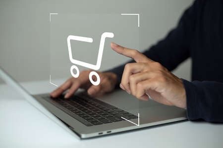 shopper using laptop and touch virtual screen online shopping. And online payment option or digital wallet online transaction concept.の写真素材
