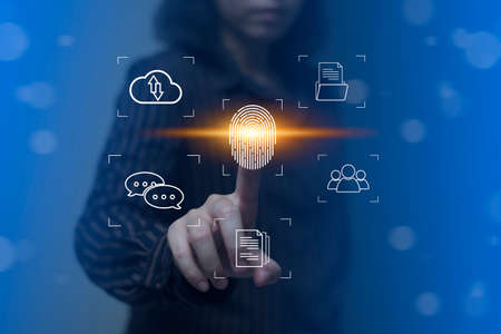 Person touching virtual screen to scan fingerprints, digital transformation management concept. Internet of Things, Big Data and Business Processes, Automation, Storage Systems, Cloud Computingの写真素材
