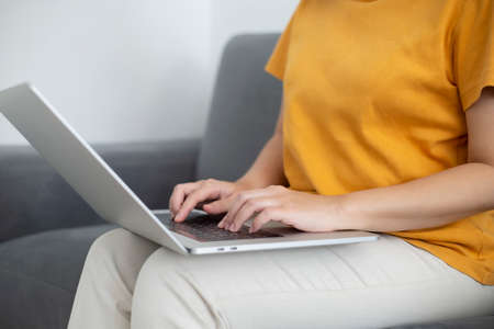 Person are using laptops, working or studying online at home. businessman using laptop work outside the officeの写真素材