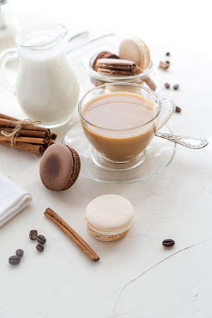 Sweet coockies and a cup of coffee with milk.の写真素材