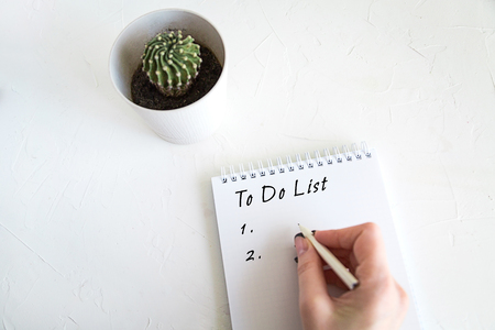 Business concept, notebook and pencil on white tableの写真素材