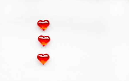 Top view of red hearts on white background, St. Valentine's Day concept.の写真素材