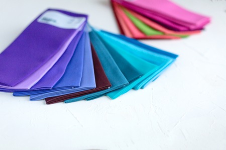 A Group of Twisted Colored Fabric on whiteの写真素材