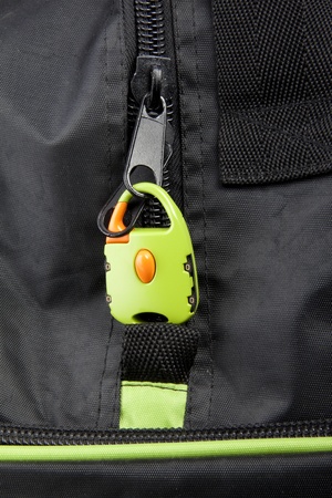 Green lock on a bag's zipperの写真素材