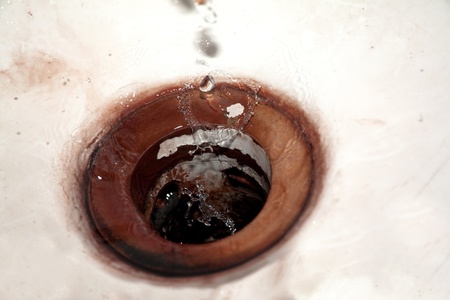 Waterdrops falling into vintage sinkの写真素材