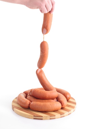 Sausages in handsの写真素材