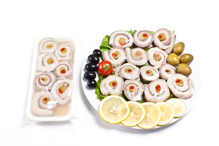 sliced fish with vegetables isolated on whiteの写真素材