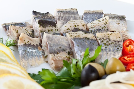 close up sliced fish with vegetables isolatedの写真素材