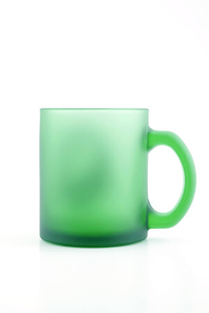 Green mat glass cup isolated on whiteの写真素材