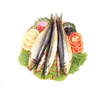 pickled herring with tomato rings isolated on whiteの写真素材