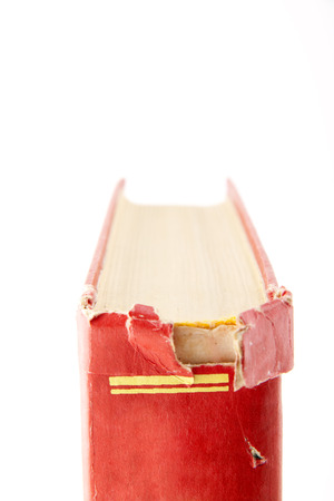 tattered book isolated on white background for siteの写真素材