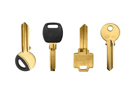 golden keys on white backgroundの写真素材