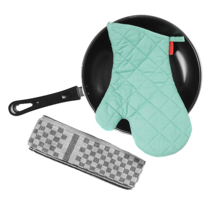 Kitchen glove in pan with grater isolaetdの写真素材