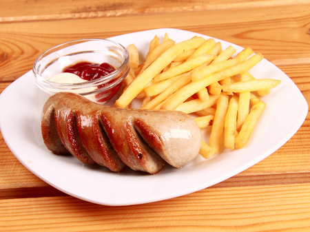 grilled sausages with French fries and ketchupの写真素材