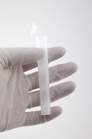 Hand holding medical tubeの写真素材