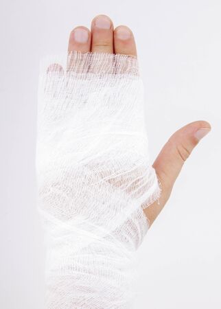 bandaged hand on white backgroundの写真素材