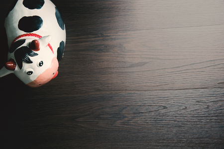 Cow paper art sculpture on the wood floorの写真素材