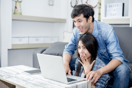 Lover are surprising when using the laptop. Family concept, Lovers concept, Technology conceptの写真素材