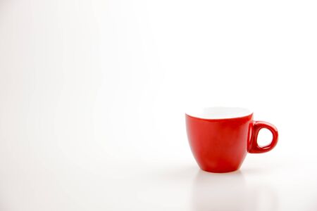 Red coffee cup on the white background with