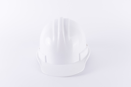 White safety helmet on white background. Hard hat and thick gloves on white isolated background. Safety equipment concept. Worker and Industrial theme.の写真素材