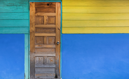 Grunge old door with color painted wall. Classical vintage and Modern Interior concept. Architecture and Home design theme.の写真素材