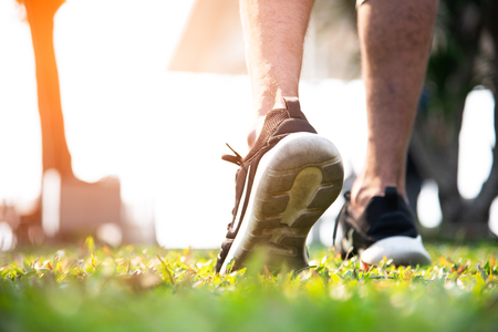 Sport man warm up to jogging at park. Exercise and Outdoors concept. Healthy activity and Lifestyle theme.の写真素材
