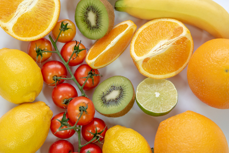 Various sliced fruits on white background. Close up of nutrition vitamin c fruits. Healthy and freshness food concept. Top view and flat lay theme.の写真素材