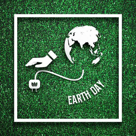 White frame with had unplugging from the earth as energy saving concept on green grass for decoration template. Eco and environment theme. Illustration graphic design element. Earth day theme.の写真素材