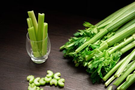 Bunch of fresh celery stalk on wooden table with leaves prepared for making juice. Food and ingredients  of healthy vegetable. Freshness herbal and low calories for dieting with plenty of vitaminの写真素材