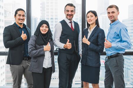 Portrait of business people group having confident in successful job in modern office background. People lifestyle and partnership colleague concept. Teamwork and cooperation diversity and multi-ethicsの写真素材