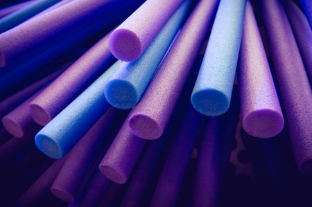 Purple and blue foam sticks background Art and abstract concept.