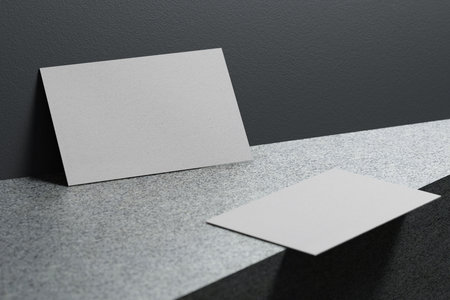 White business card paper mockup template with blank space cover for insert company logo or personal identity on marble floor background. Modern stationary concept. 3D illustration renderの写真素材