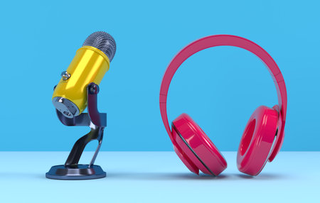 Yellow PODCAST Microphone and pink headphone on blue background. Entertainment and online video...