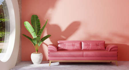 Cozy pastel pink sofa in modern living room with banana plant and look through glass window garden outside outdoor view on concrete floor. Architecture and interior concept. 3D illustration renderingの写真素材