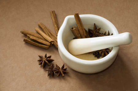 Mortar and pestle with cinnamon and star anise.の写真素材