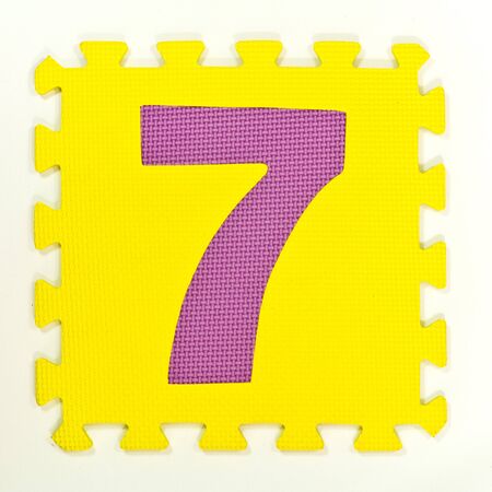 Number Puzzle Pieces on White Background