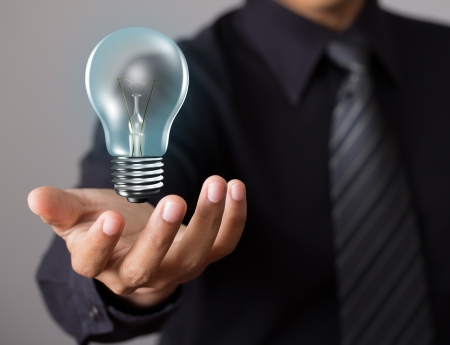 Light bulb in businessman handの写真素材