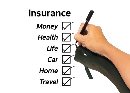 Business man writing insurance conceptの写真素材