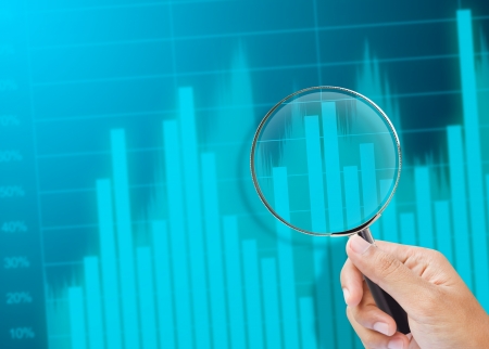 magnifying glass zoom on a business chartの写真素材