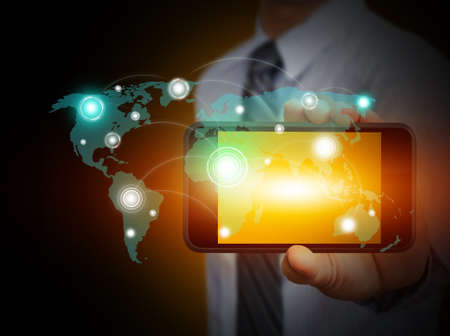Touch screen mobile phone with businessmenの写真素材