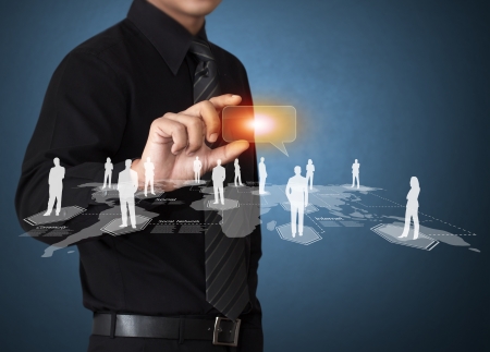 Business man touching virtual icon of social networkの写真素材