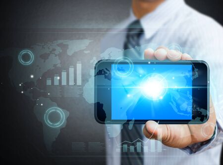 Modern technology mobile phone in a handの写真素材