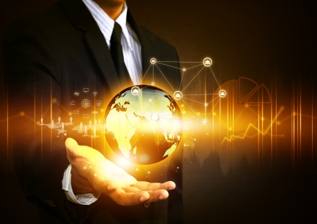 Business people holding social network with globeの写真素材