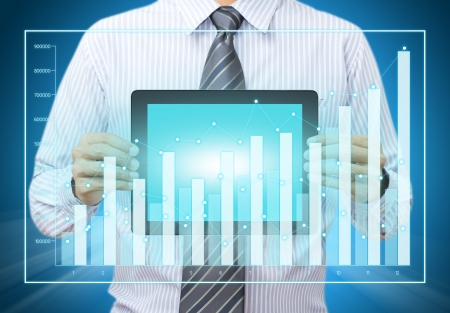 Touch screen tablet with growth chart in male handの写真素材
