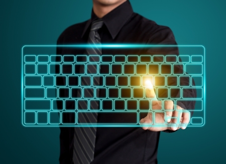 Business man pressing virtual type of keyboardの写真素材