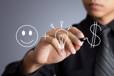 Business man writing investment conceptの写真素材