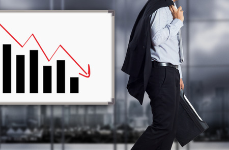 Businessman with failure chartの写真素材