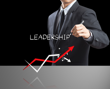 Business man writing leadership concept with growth arrow, Leadership conceptの写真素材